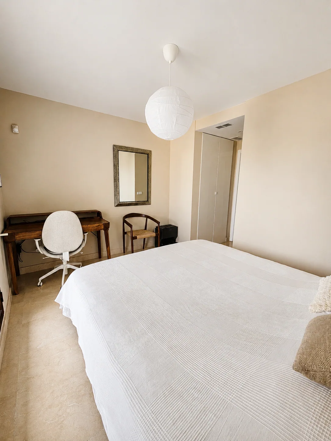 Guest bedroom with balcony view