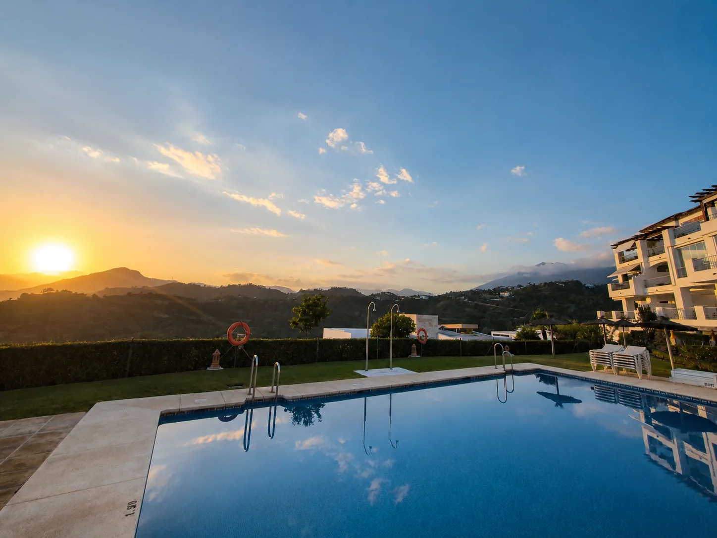 Pool and mountain views at sunset